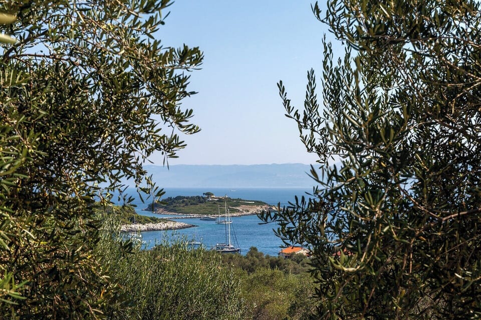 Glorious views out to Panayia Island and Gaios Town below, just a 5-minute drive away.