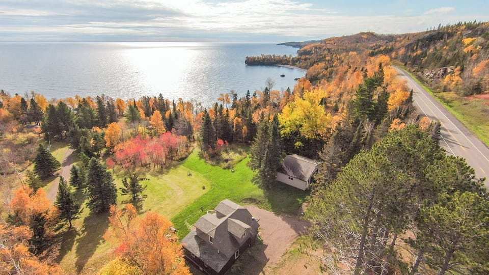 Aerial view of Thorson's Cottage and Lake Superior.
