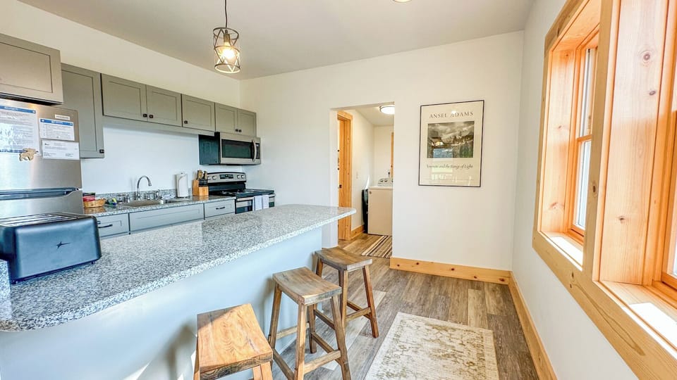 The kitchen is located off of the living room.