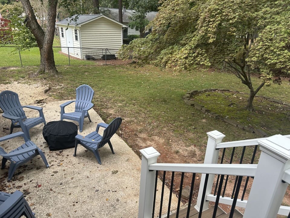 Firepit with 8 Adirondack chairs.