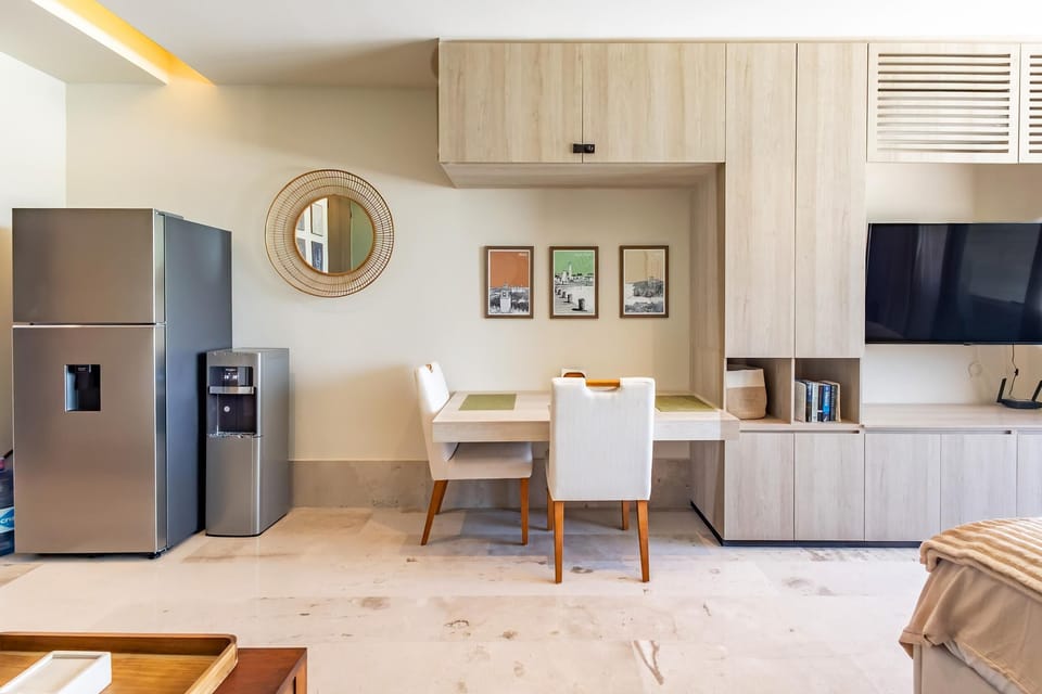 Your dining area with a water garafon dispenser for easy hydration (refills available upon request)