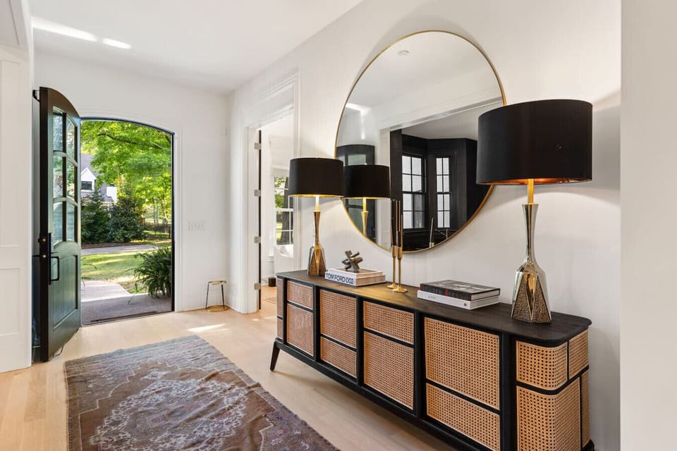 This cozy, spacious living room features a Smart TV, gas fireplace, and unique artwork - creating the perfect space to gather.
