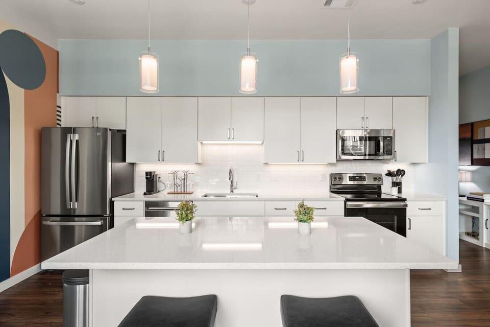 Lots of natural light pouring into this fully equipped kitchen. Seating for two at the island. Private balcony located off of the kitchen.