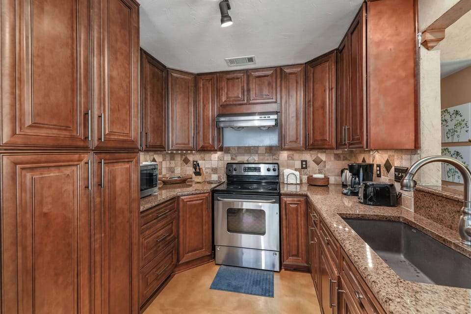 Rich wood cabinets and large sink
