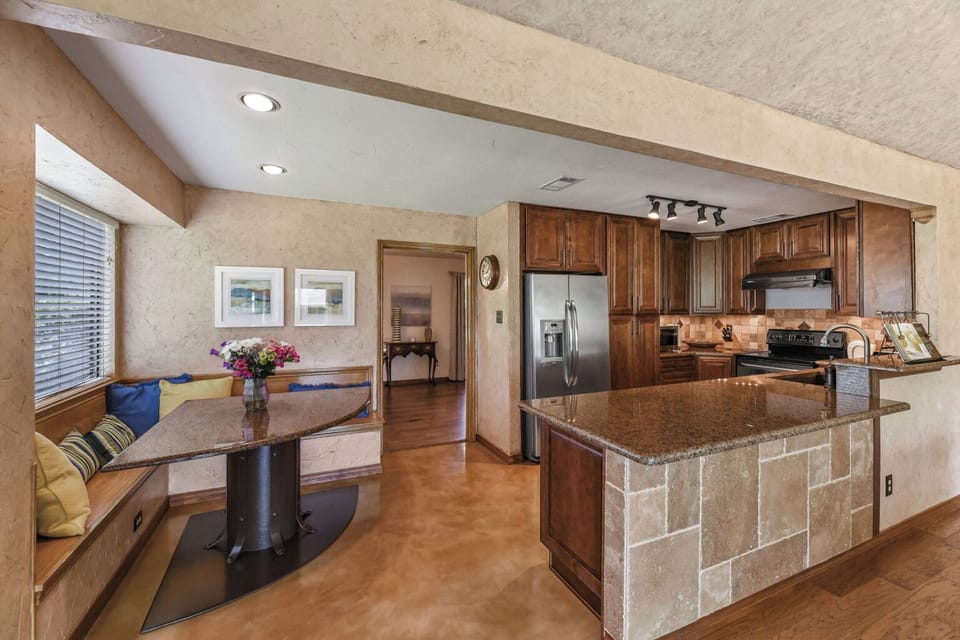 Open kitchen area with modern French door fridge