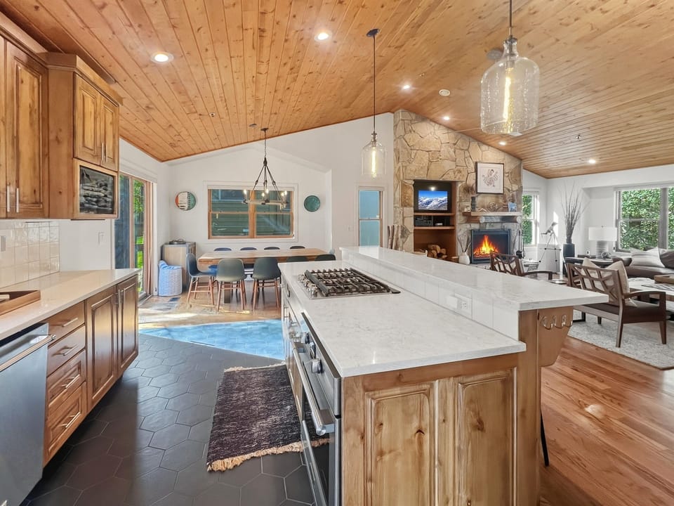 Open kitchen and living space ideal for family meals and cozy nights - come in, settle down, and make memories right here! 
