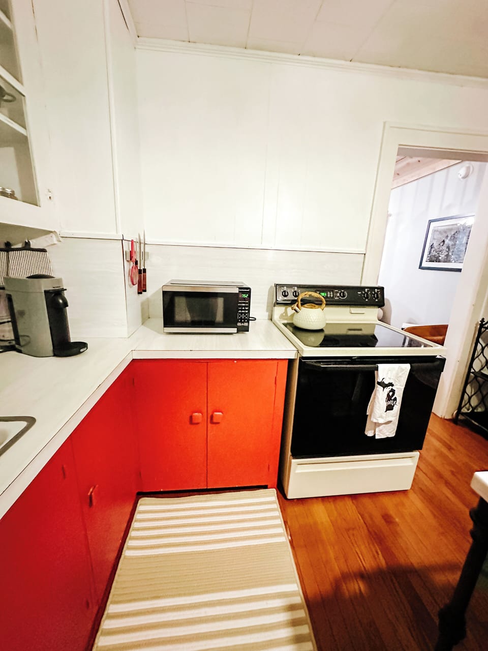 Microwave and full size stove. Kitchen fully stocked with crockpot & lots pans.
