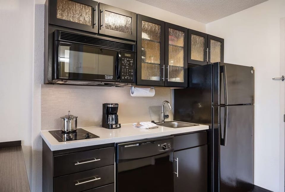 Brew coffee and prep snacks with convenient in-room appliances.