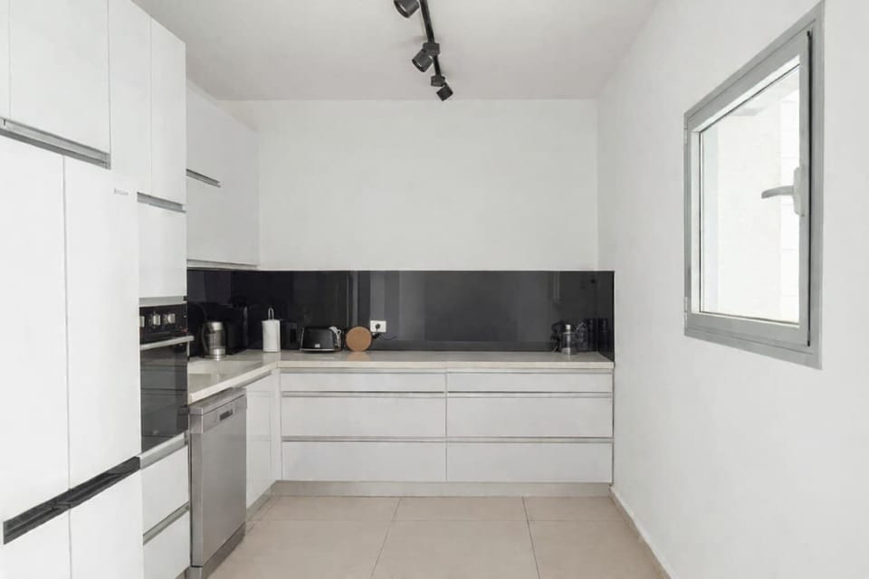 Modern kitchen thoughtfully arranged for effortless cooking, making longer stays comfortable and practical every day.