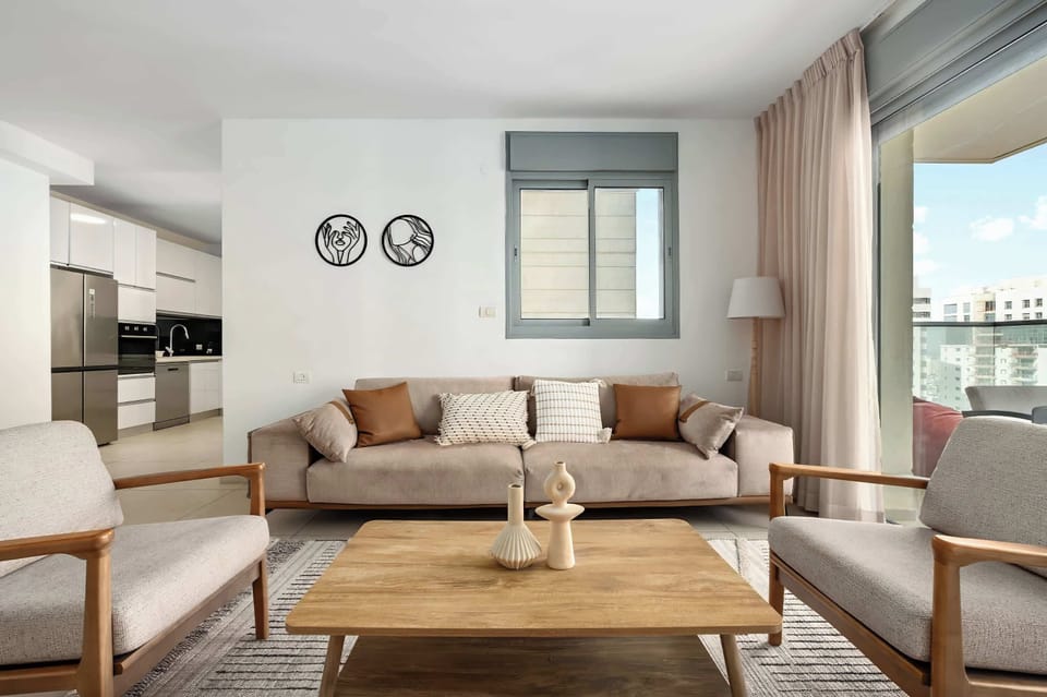 Open-plan living design connects kitchen and lounge seamlessly, creating welcoming shared moments throughout your stay.