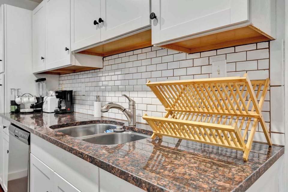 Our sleek kitchen fully equipped with modern appliances for your culinary needs!