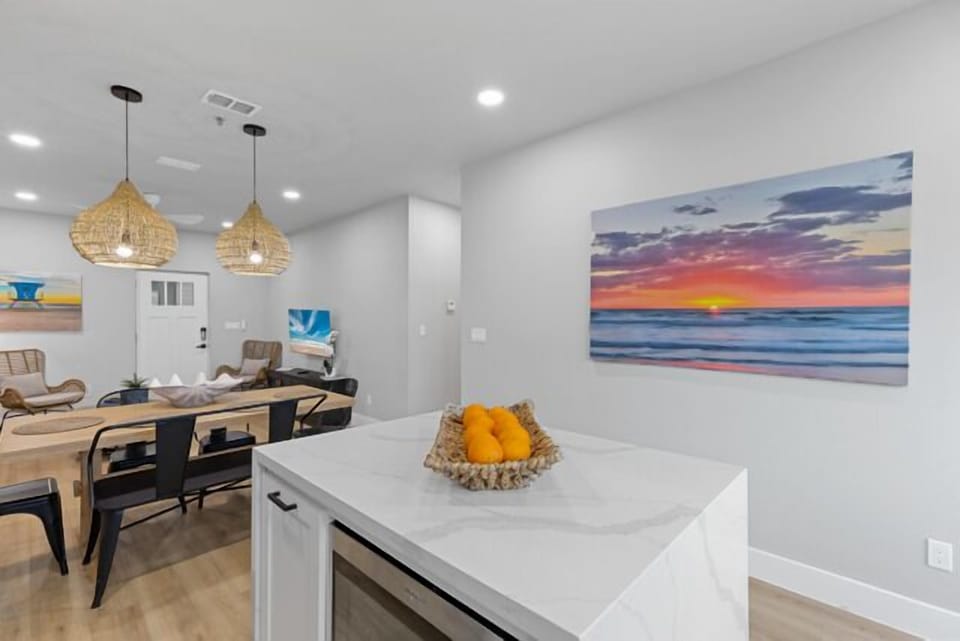 Fully equipped kitchen with stainless steel appliances and a large island perfect for your family or friend meals.