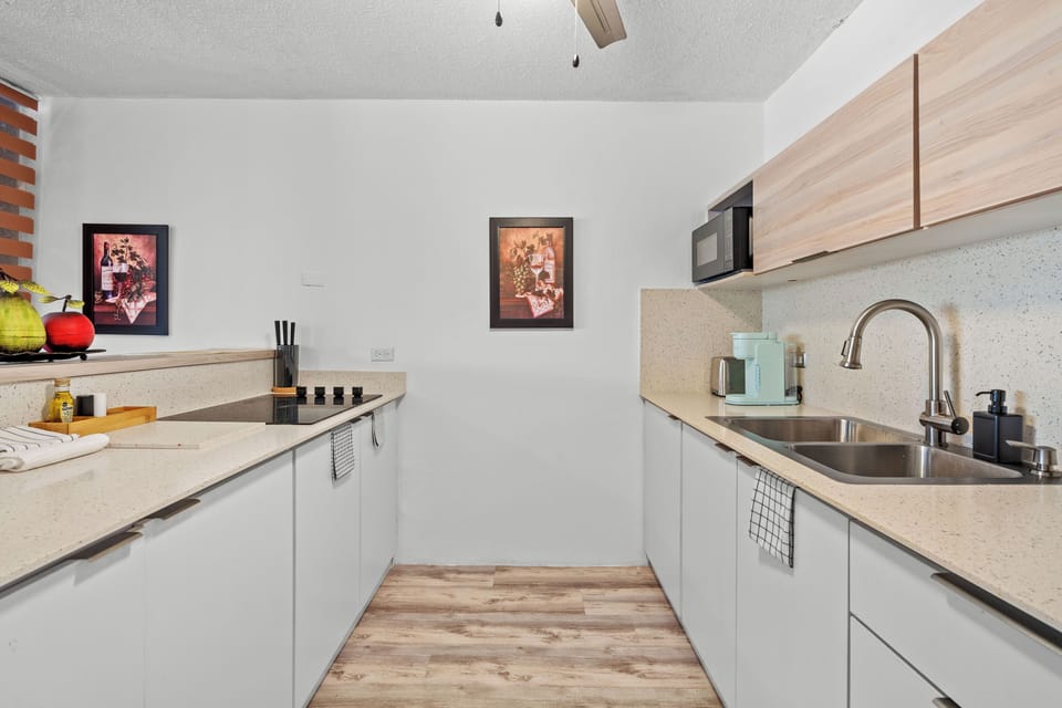 Fully equipped and stylish kitchen ready for your culinary adventures, complete with modern appliances and ample counter space.
