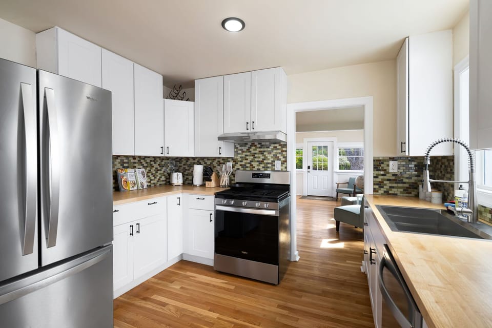 Sleek, fully equipped kitchen with stainless appliances.