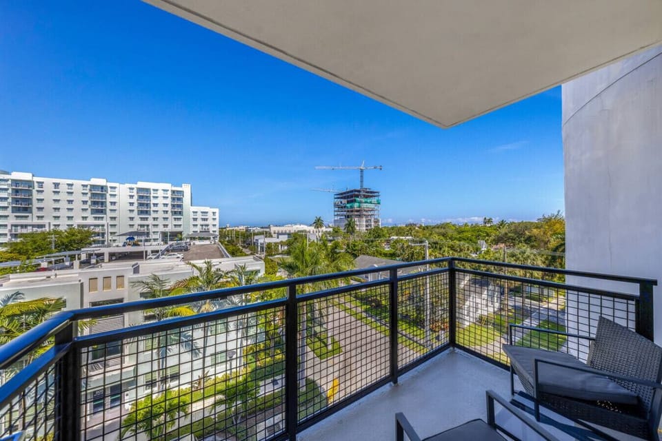 Private Balcony with City Views-Relax on your private balcony with seating, overlooking the courtyard and pool below. Enjoy fresh air and a glimpse of Fort Lauderdale’s skyline.