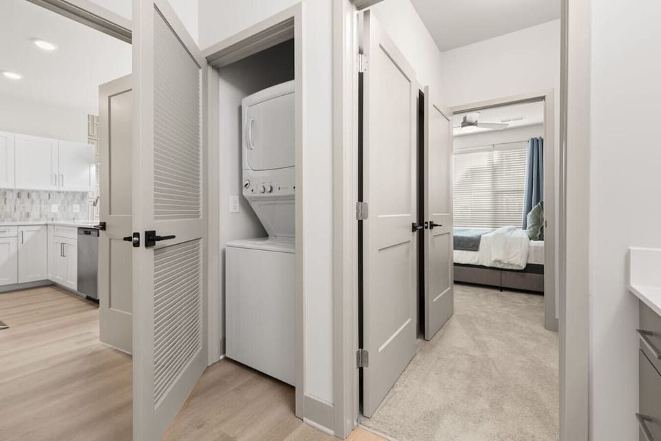 In-Unit Laundry – Convenient washer and dryer set tucked neatly in a hallway closet. Perfect for long stays, offering guests the comfort of doing laundry at home.