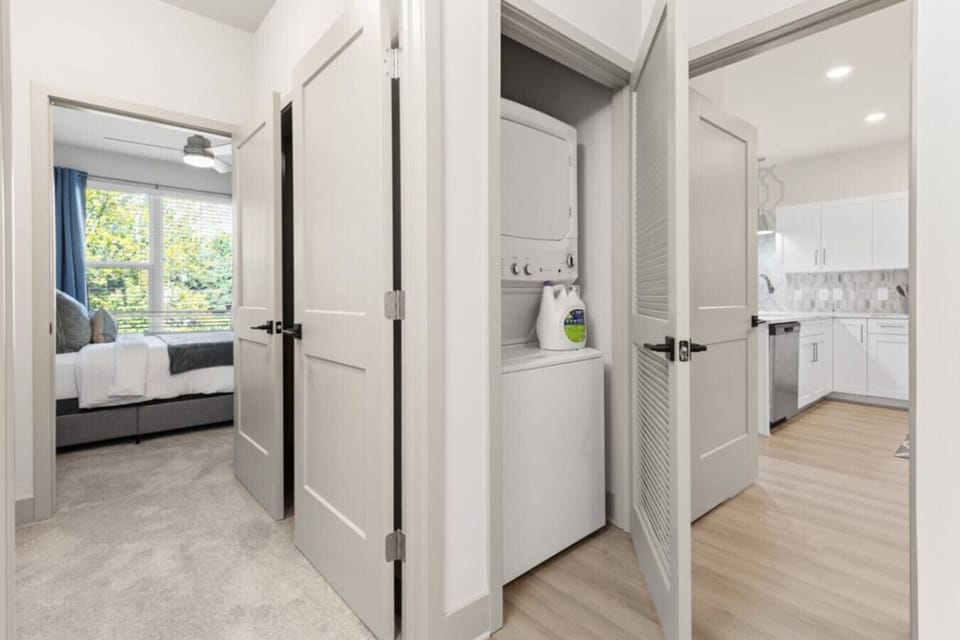 In-Unit Laundry-Convenient washer and dryer tucked into a closet space, making it easy to handle laundry during your stay without leaving the comfort of your home.