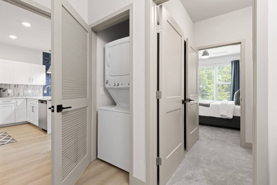 In-Unit Laundry-Convenient washer and dryer tucked into a closet space, making it easy to handle laundry during your stay without leaving the comfort of your home.