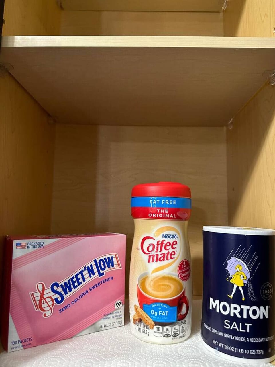 Guest Pantry Essentials-Stocked cabinet with Sweet’N Low, Coffee-mate creamer, and Morton salt for added convenience. Thoughtful touches to make your stay more comfortable and hassle-free.