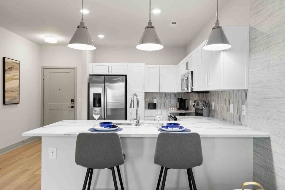 Casual Dining at the Breakfast Bar-Grab a seat at the breakfast bar for a quick cup of coffee or a casual meal. This sleek, modern kitchen is fully equipped with everything you need to make dining and cooking a breeze.