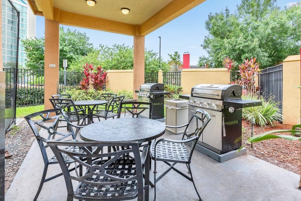 Outdoor dining area with BBQ grill
