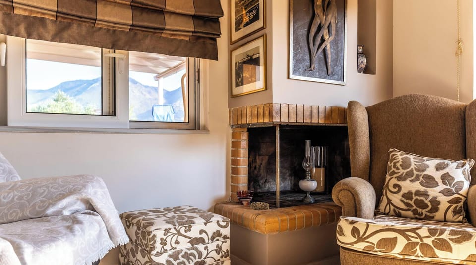Cozy Fireplace Corner with Armchairs – Perfect nook for a warm evening indoors.