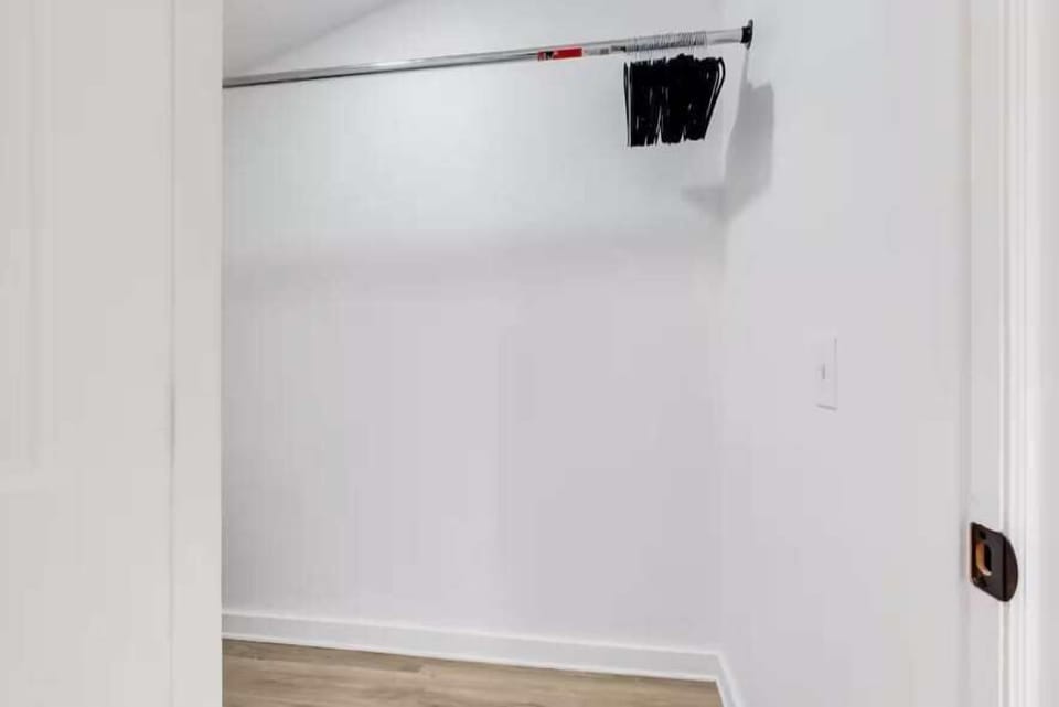 This stylish space is designed for effortless organization, with sleek hangers and ample racks to keep your clothes neatly arranged.