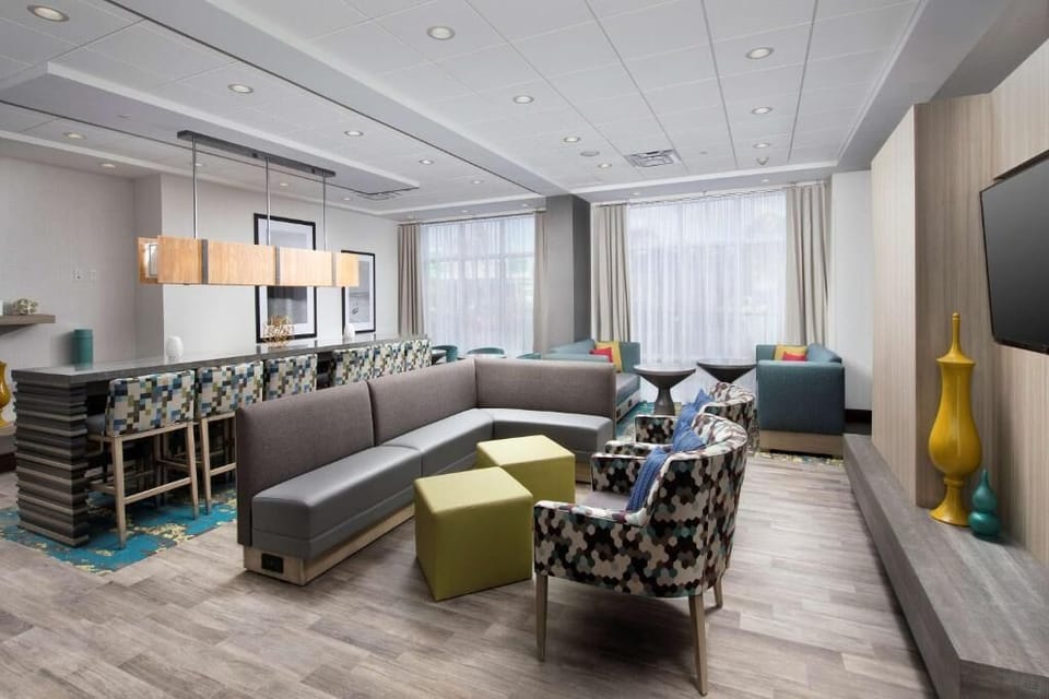 Unwind in the bright lounge with cozy seating and calm vibes.