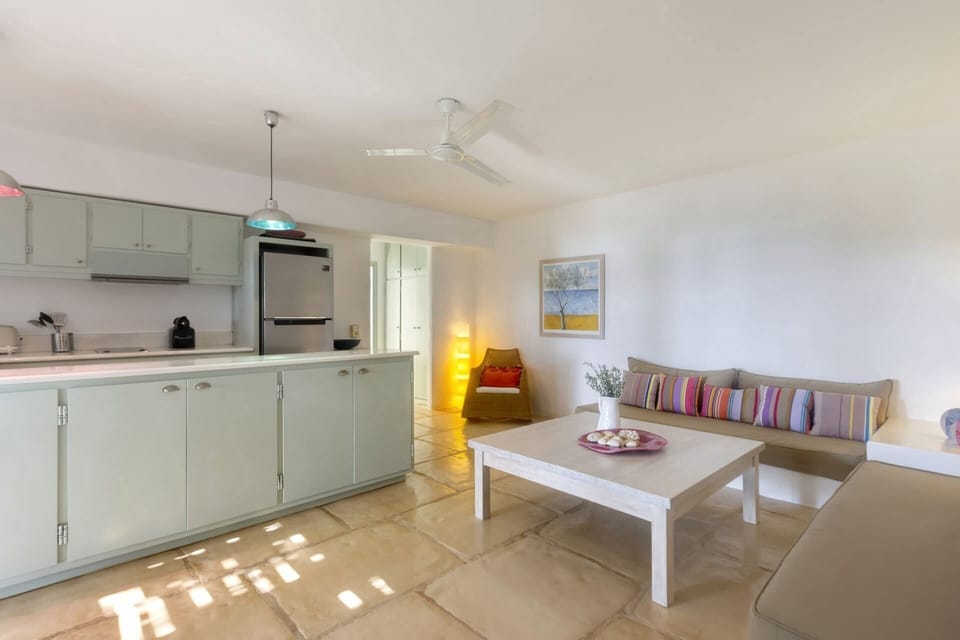 The well-equipped kitchen in the guesthouse serves the al fresco dining area.