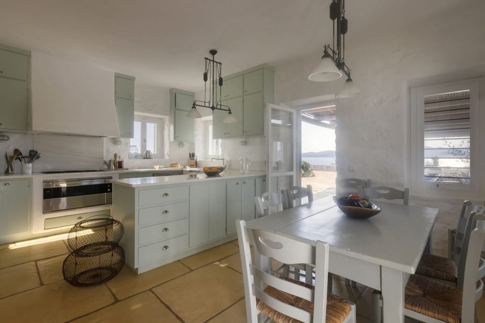 The good-sized, well-equipped kitchen in the main house with its breakfast table.