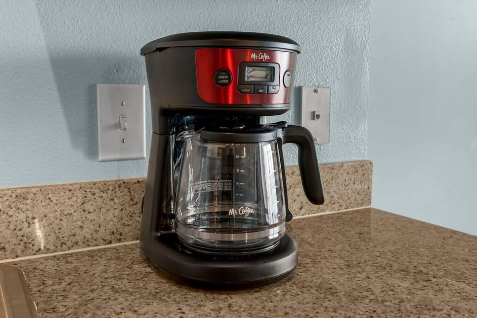 Enjoy fresh-brewed coffee anytime with the easy-to-use drip coffee maker, perfect for starting your beach day right.