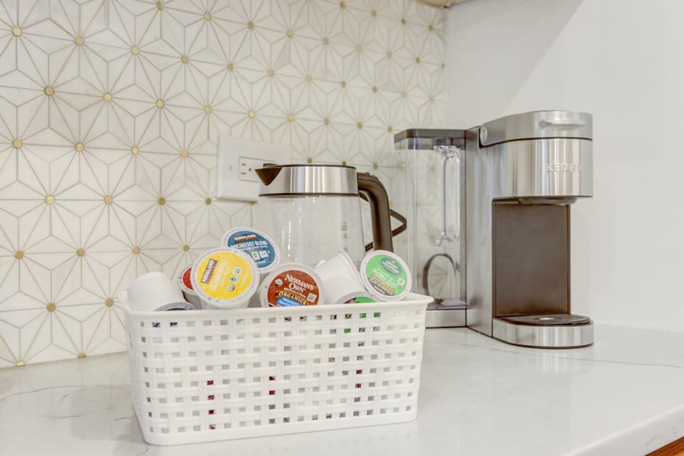 A coffee section in the kitchen with a variety of flavor options!