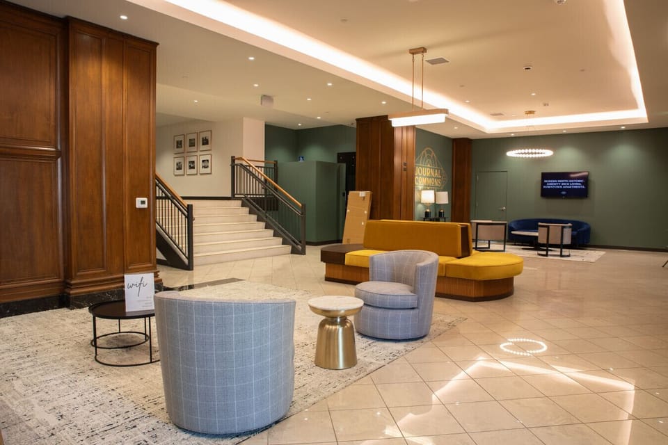 Community lounge with work areas and kitchen