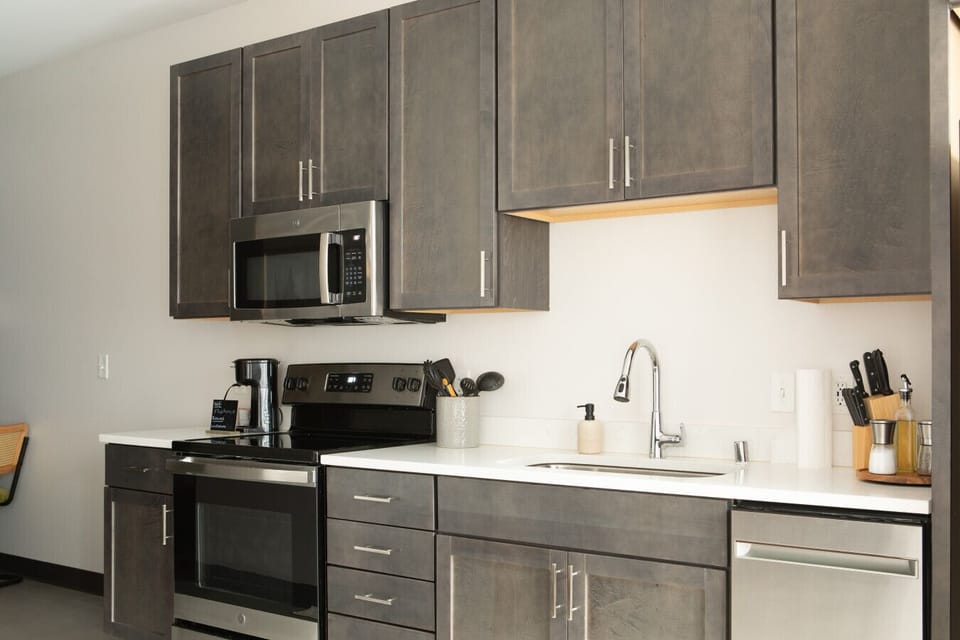 Full kitchen with dining table/workspace