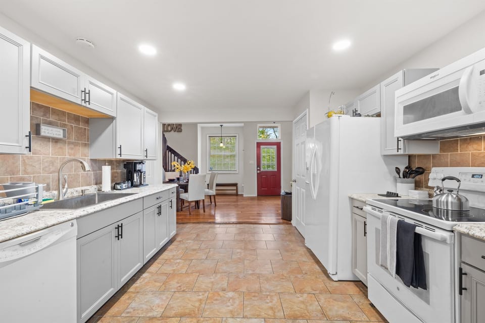 Kitchen: Modern appliances meet charming decor, perfect for culinary adventures!