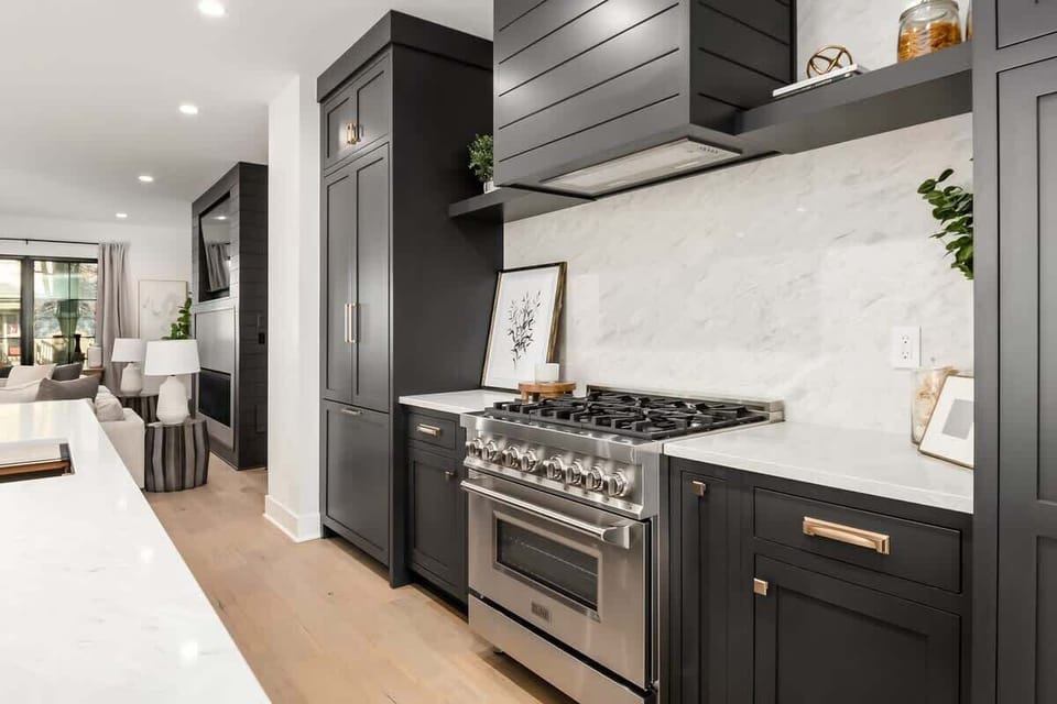 Custom built kitchen with gas burner stove and hidden refrigerator