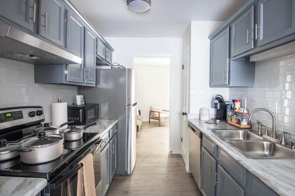 Fully equipped kitchen with stainless steel appliances and everything you need to cook at home.