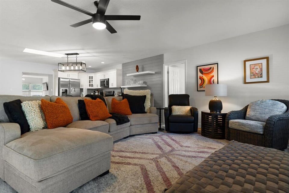 Bright and inviting living room with plush seating and open layout designed for comfort and relaxation