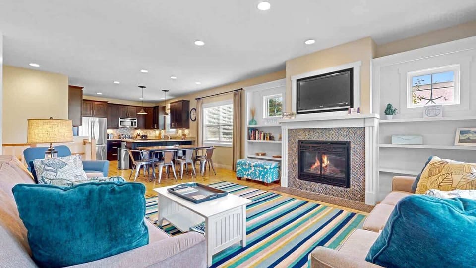 Open concept main floor with living, dining, and kitchen plus 3 bedrooms on the main level.  