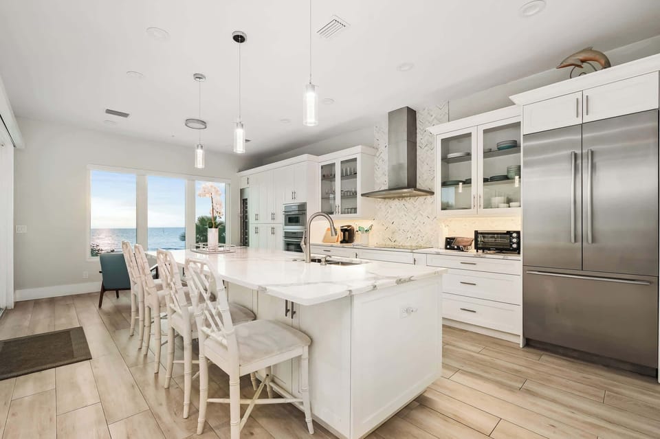 Start your mornings at the bright breakfast bar, where seating for four makes it the perfect place for casual meals, coffee, or evening wine with friends.