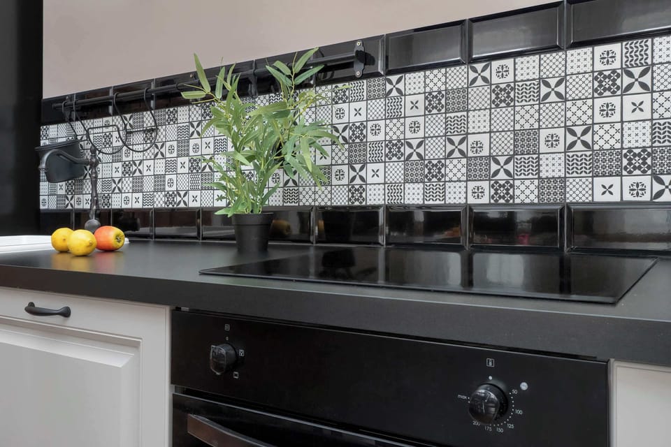 Kitchenette with plenty of kitchen utensils and dishes. 