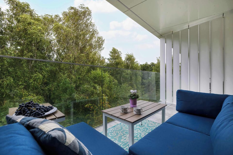 A balcony with comfortable furniture invites you to relax and unwind in the fresh air.