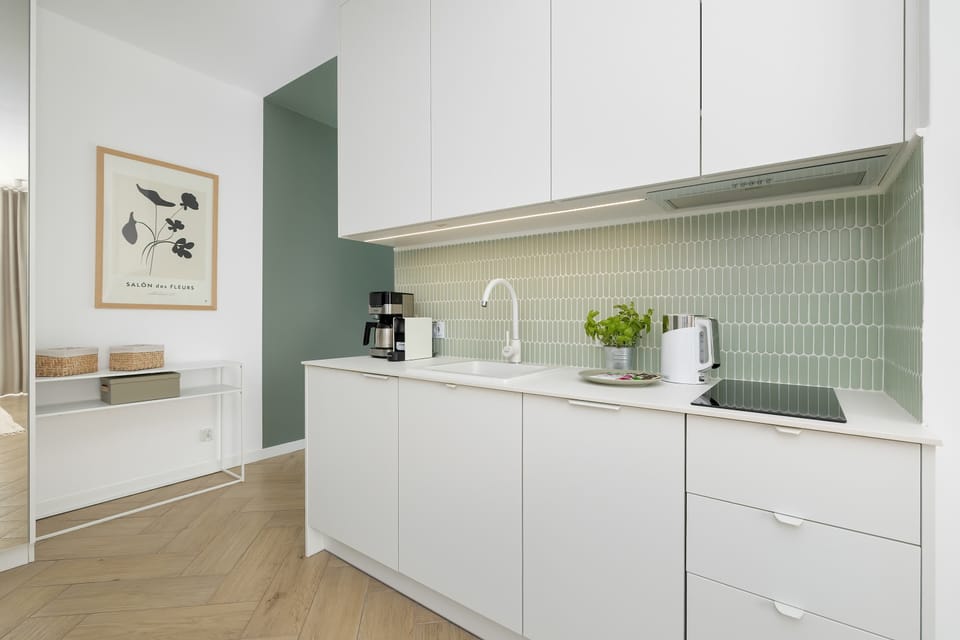 The fully equipped kitchenette includes everything you need for a home-cooked meal.