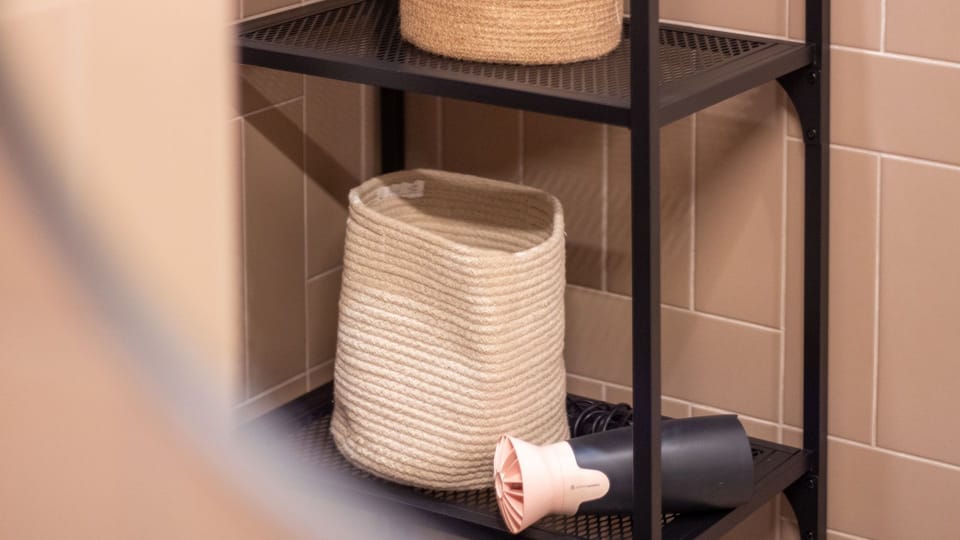 Find everything you need for your daily routine neatly organized on this convenient bathroom shelf. The included hairdryer and storage solutions add an extra layer of comfort and practicality to your stay. #BathroomEssentials #ConvenientAmenities