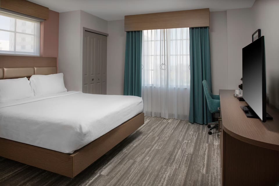 Unwind in a spacious, serene room with modern comforts.