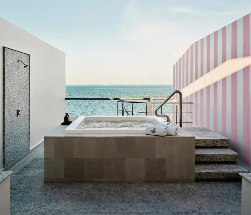 Soak at sunset in your ocean-view hot tub retreat.