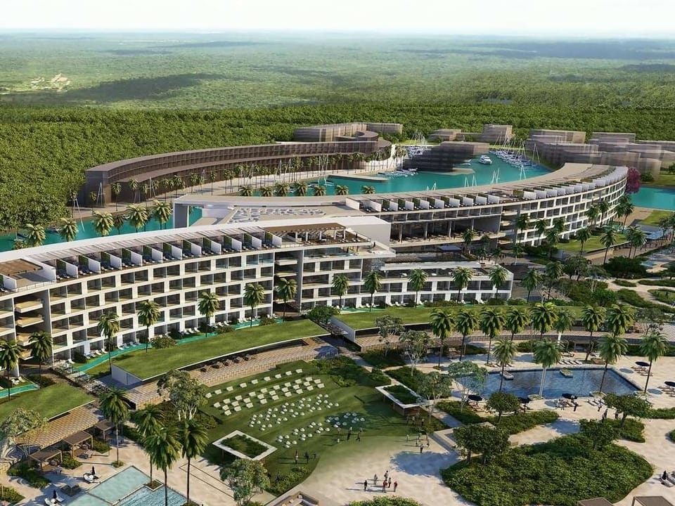 Soar above a grand resort framed by jungle serenity.