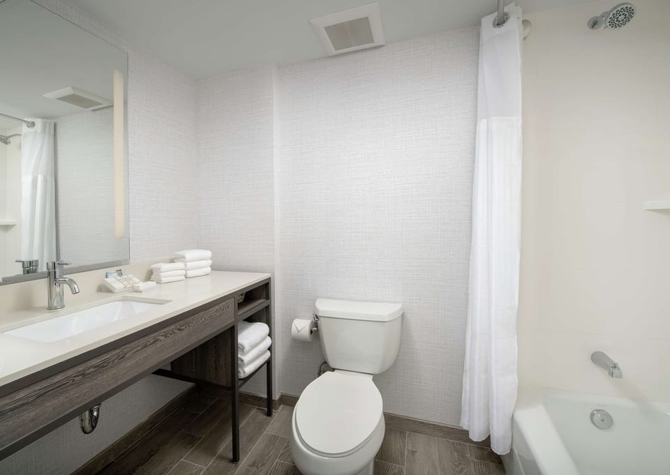Refresh easily with bright vanity lighting and fresh towels.
