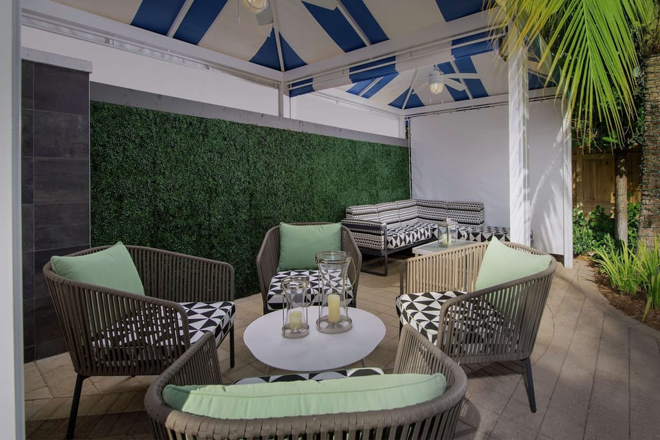 Unwind under the cabana with plush seating and shade.