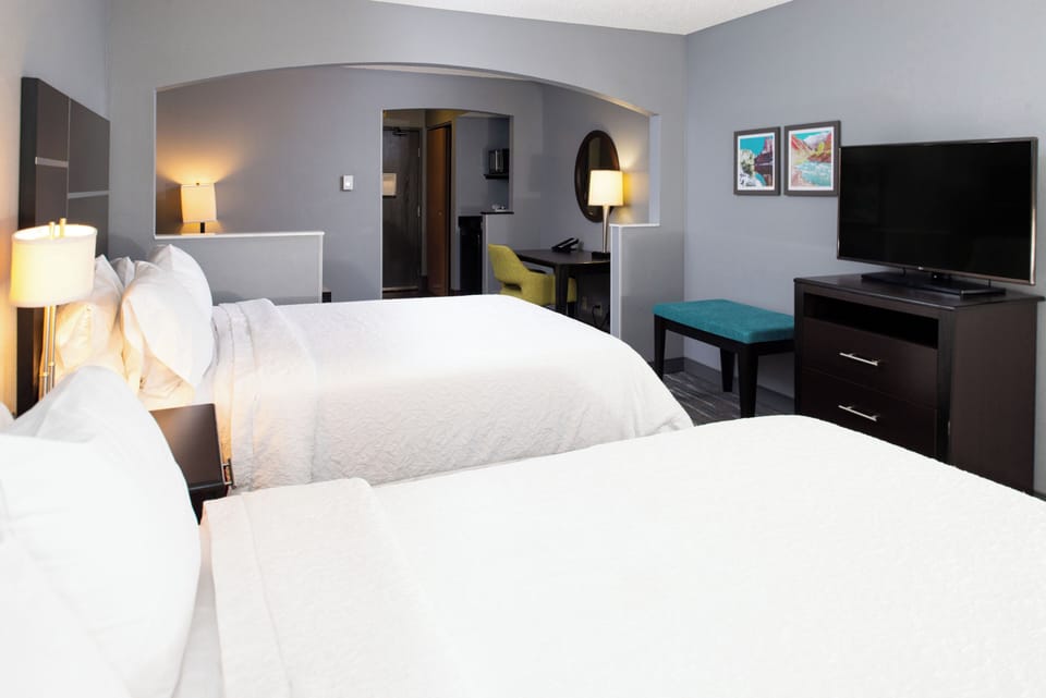 Sink into crisp white bedding for a deeply restful night.